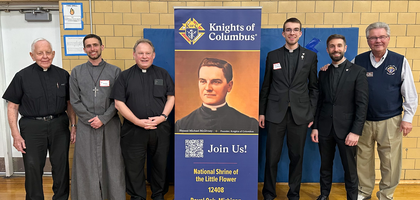 Grand Knight Bill Kostrzewa (right) stands with priests and seminarians from the Archdiocese of at the annual Desert Meal organized by National Shrine of the Little Flower Council 12408 in Royal Oak, Mich.