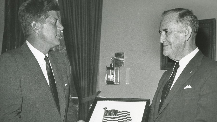 Then-Supreme Knight Luke E. Hart presents President John F. Kennedy with a framed copy of the Pledge of Allegiance during a meeting at the White House on Oct. 11, 1961. 