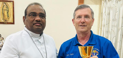 Steve Taylor, faithful navigator of Father Michael J. Bader Assembly 2430 and a member of Walter Pollard Council 5480 in Newport News, Va., delivers a chalice and paten set on behalf of the council and assembly to Cardinal Anthony Poola, archbishop of Hyderabad, India. The presentation was made during Taylor’s recent trip to Hyderabad to visit an orphanage that Council 5480 has supported financially.