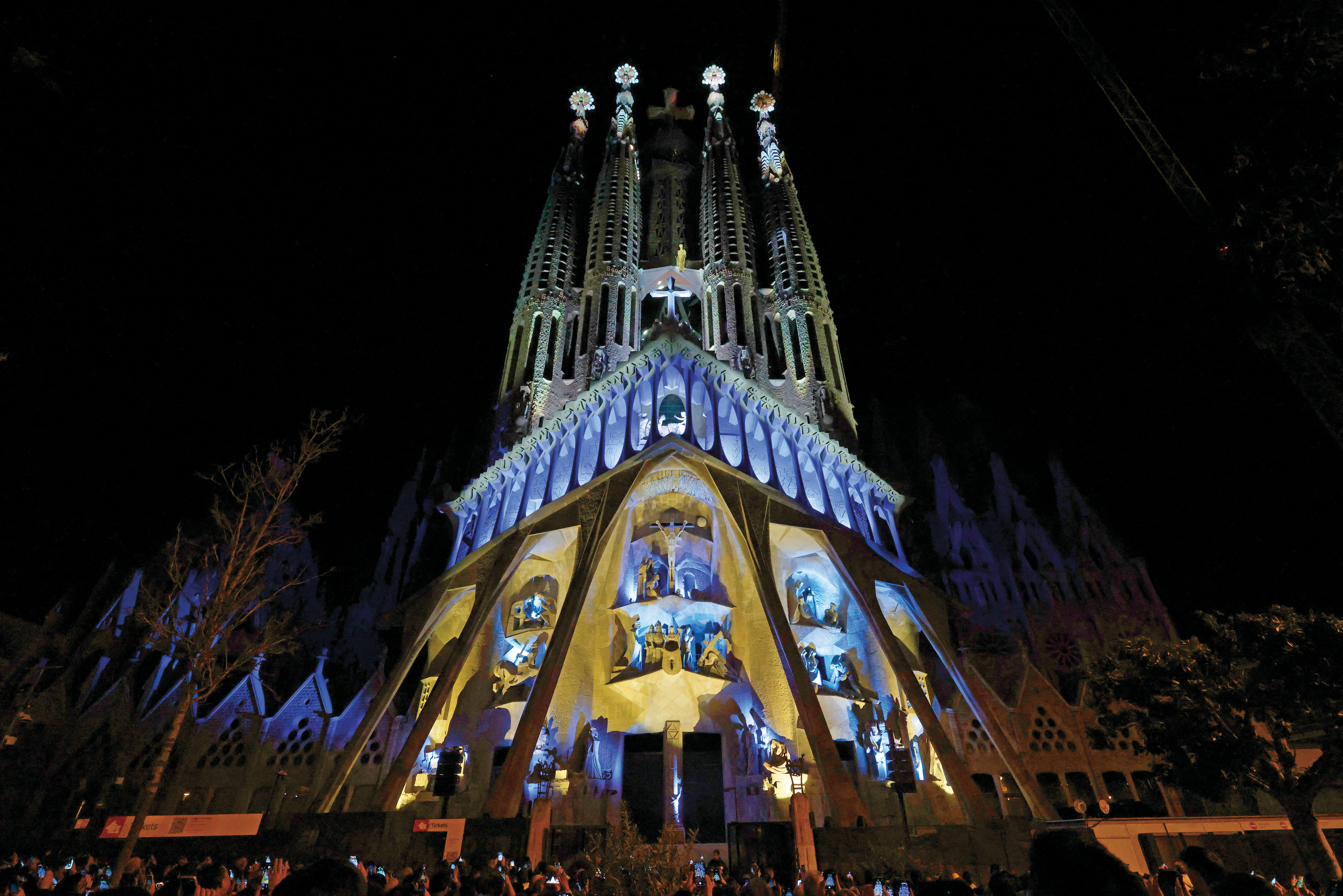 Lights illuminate Sagrada Fam&iacute;lia's Passion fa&ccedil;ade.