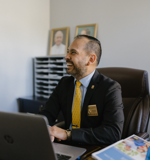 Sandoval Agent Flores At Desk.jpg