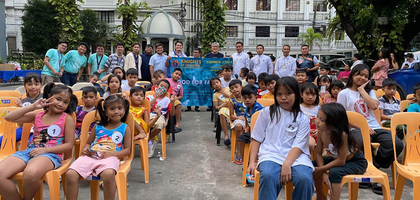 Members of Our Lady of Consolation y Correa Council 17553 in Intramuros, Luzon South, assemble behind a group of children during a food distribution organized in partnership with the Luzon South State Council.