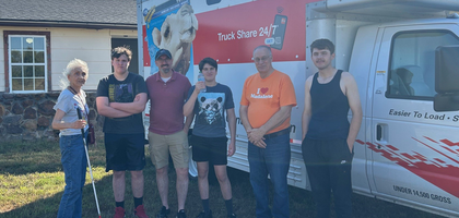 Knights from Church of the Madalene Council 17383 in Tulsa, Okla., gather with Karen Schulte, a parishioner from the Church of the Madalene, during a council service day. 