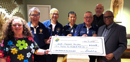 Knights from St. Agnes Kouying Tsao Council 15176 in Markham, Ontario, present a check for over CA$5,600 to representatives of Good Shepherd Ministries in Toronto. The council also donated more than 2,300 pounds of food to the organization, which serves people experiencing homelessness.