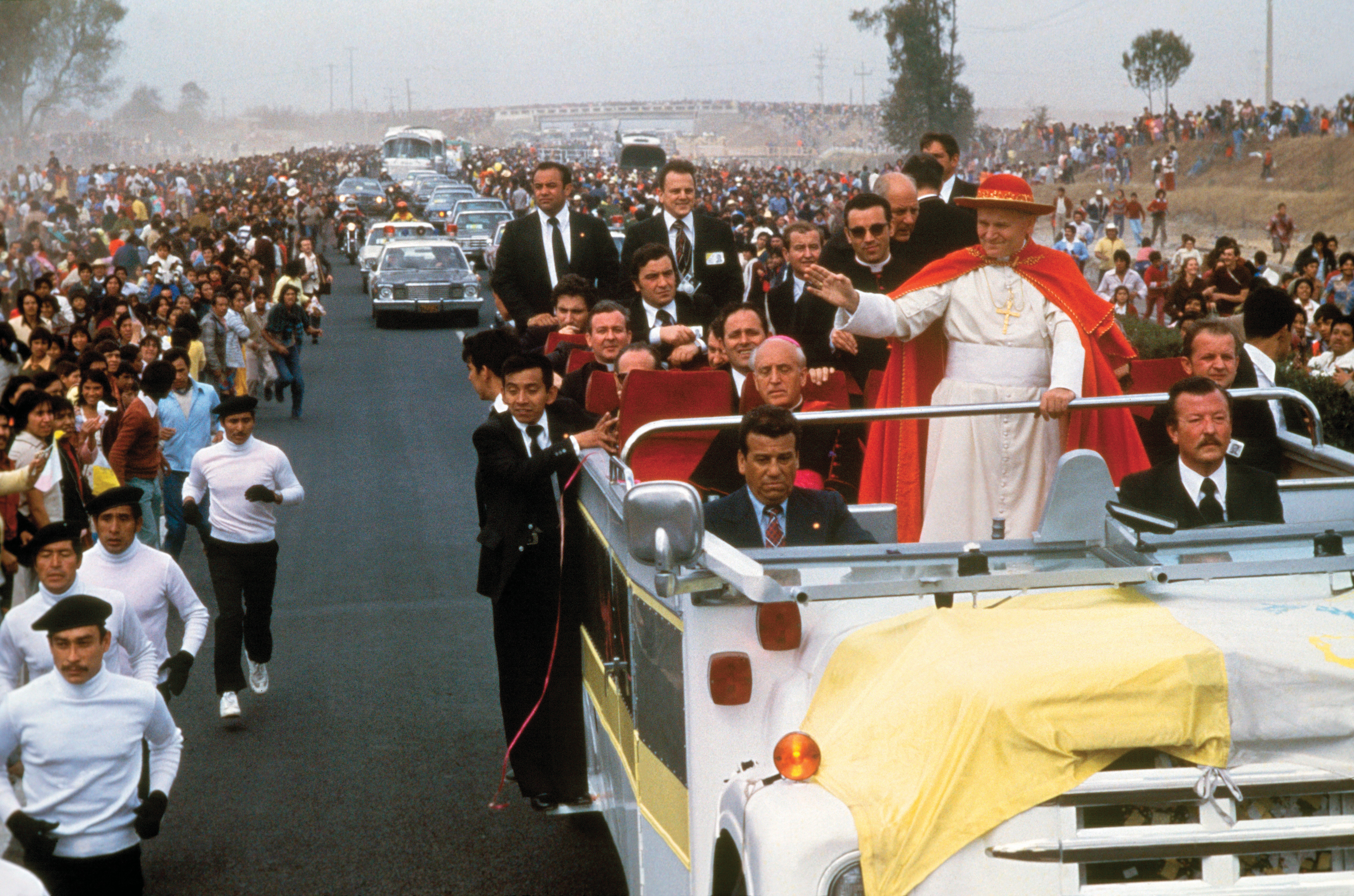 Pope John Paul II greets the faithful as he is driven through Oaxaca, Mexico, on Jan. 28, 1979, during the first papal visit to the country.