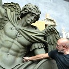 Sculptor Sergey Eylanbekov works on a statue of St. Michael the Archangel at his studio in Pietrasanta, Italy.