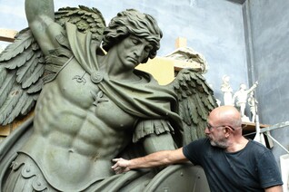 Sculptor Sergey Eylanbekov works on a statue of St. Michael the Archangel at his studio in Pietrasanta, Italy.