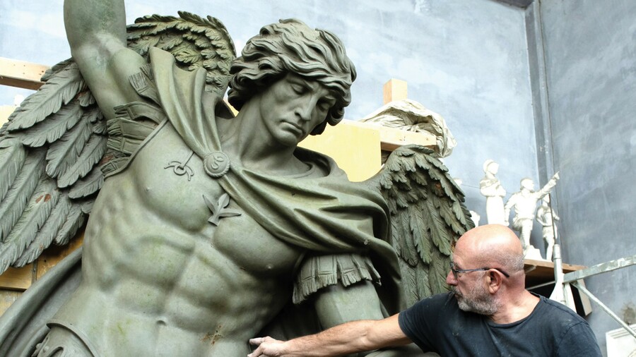 Sculptor Sergey Eylanbekov works on a statue of St. Michael the Archangel at his studio in Pietrasanta, Italy.