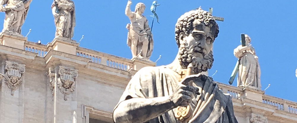 Famous bronze statue of St. Peter near the entrance of St. Peter's Basilica in Vatican City.