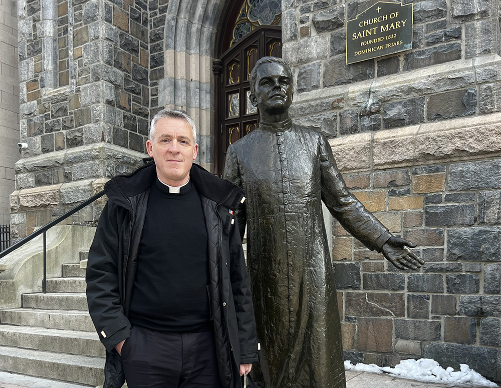 State Chaplain Of France Stands With McGivney Statue