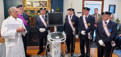 Fourth Degree Knights from Our Lady of Victory Assembly 1945 in State College, Pa., stand at attention during a blessing of a new ultrasound machine donated to the city’s Pregnancy Resource Clinic by Father O’Hanlon Council 4678 in State College. 