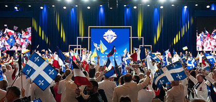 Knights of Columbus and guests wave the flags of the Order’s jurisdictions at the opening of the annual States Dinner at the 142nd Supreme Convention in Québec Aug. 6.