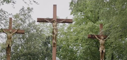 Stations of the cross statues on hillside at Lourdes in France. Statues on a rocky hillside.
