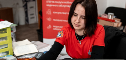 Emergency responder helping with paperwork.