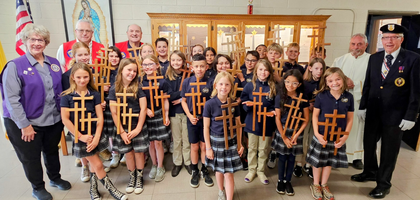 Fourth-grade students at St. Columba Catholic School display handmade crosses presented to them during Holy Week by members of Durango (Colo.) Council 1408 and Dominguez-Escalante Assembly 2072.