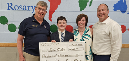 Grand Knight Paul Callahan of Father John J. Wenzel, S.J., Council 10003 in Milford, Ohio, stands with eighth-grader Griffin Hantak and his parents after presenting him with a $1,000 scholarship at St. Elizabeth Ann Seton School’s eighth-grade graduation banquet. This year, Council 10003 awarded two $1,000 scholarships to support incoming freshmen attending Catholic high school.