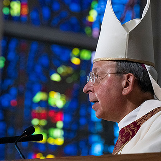 Supreme Chaplain Archbishop William E. Lori of Baltimore reads the English translation of the apostolic letter declaring Father Michael McGivney a blessed.