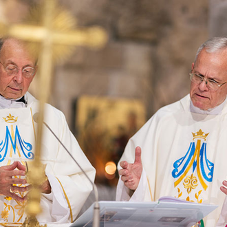 Msgr. Peter Vaccari (right), president of CNEWA, concelebrates Mass with Supreme Chaplain Archbishop William Lori at the Grotto of the Annunciation in Nazareth. (Photo by George Jaraiseh)