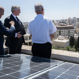 Supreme Knight Patrick Kelly and Msgr. Peter Vaccari, president of the Catholic Near East Welfare Association, view the territorial divide between Israel and Palestine from atop the Comboni Sisters’ house in East Jerusalem on Sept. 3. (Photo by Joseph Saadeh)