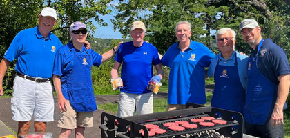 Members of Our Lady of Mount Carmel Council 4160 in Doylestown, Pa., gather behind a grill as they cook hamburgers and hot dogs at the council’s “welcome back” barbecue at Peace Valley Park for more than 120 seminarians from St. Charles Borromeo Seminary in Philadelphia. The seminarians enjoyed a night of prayer, food and games organized by the Knights.