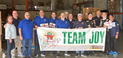 Knights and family members from St. John XXIII Council 14390 in Miramar, Fla., and Mother of Our Redeemer Council 17477 in Miami gather after preparing Boxes of Joy — shoebox-sized packages filled with toys, clothing, school supplies or other items — for children in South America.