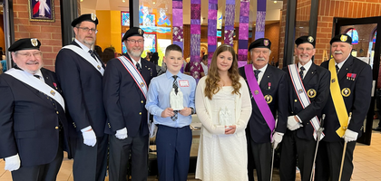 Members of Holy Family Assembly 3250 in Chattanooga, Tenn., gather with Landan Clark (left) and Charli Horn after a Mass at St. Stephen Church during which the two were among more than 40 youth who received the sacrament of confirmation. After the liturgy, Holy Family Council 6099 presented each confirmand with a small statue depicting the Holy Family. 