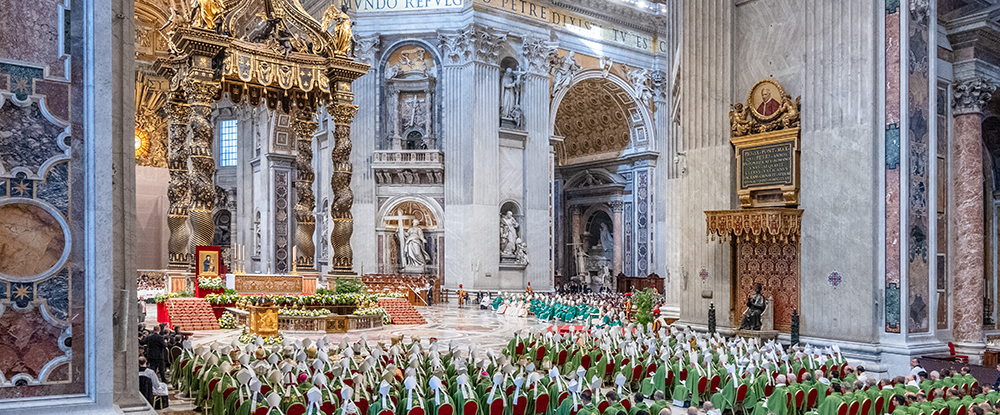 The baldacchino in St. Peter’s Basilica is pictured before and after restoration; the first photo was taken in late January, the second Oct. 26, the day before the closing Mass of the Synod of Bishops on synodality. (Photos by Tamino Petelinšek)