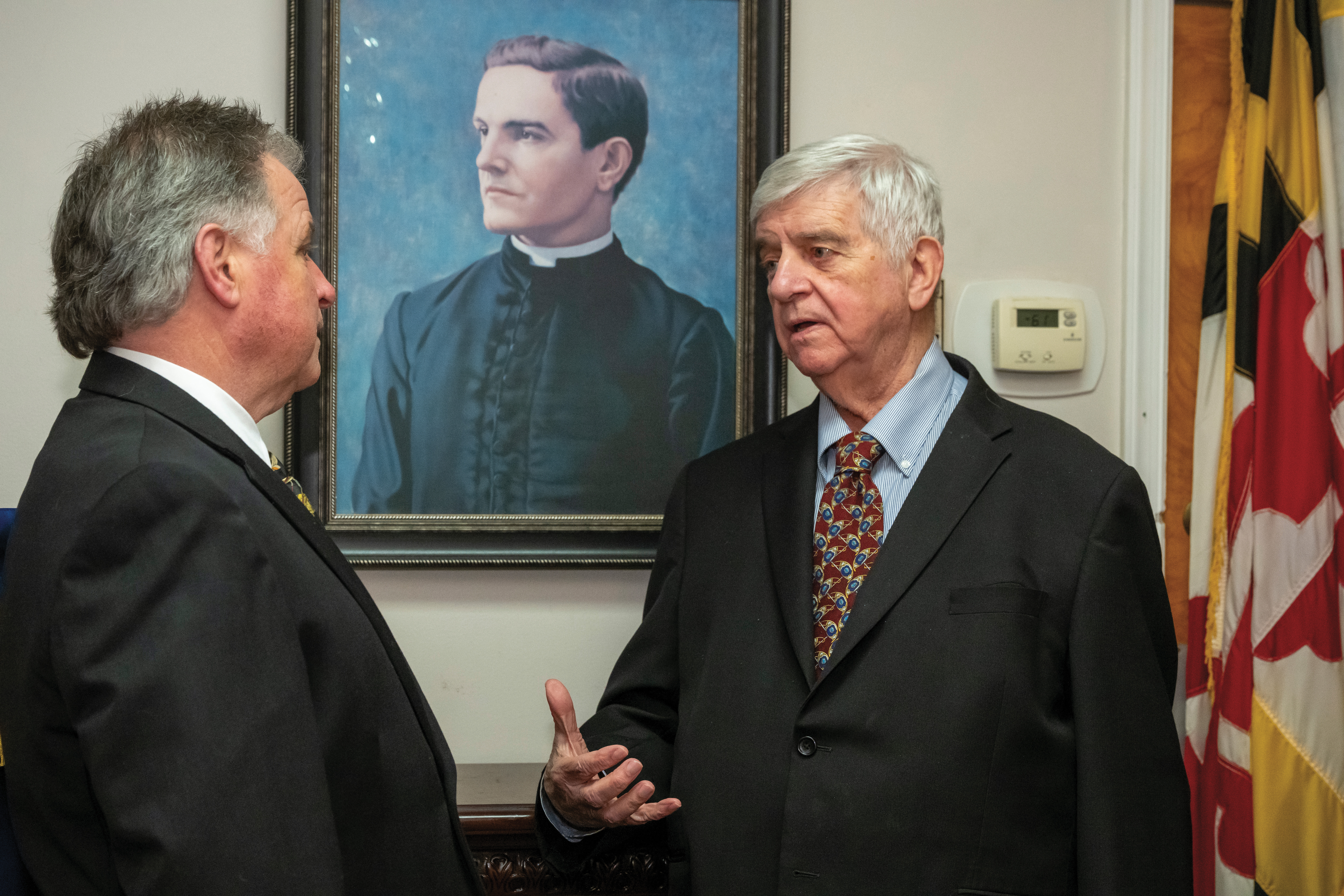 Timothy McCarthy speaks with Past Grand Knight Michael Duffy during an officers&rsquo; meeting in March.