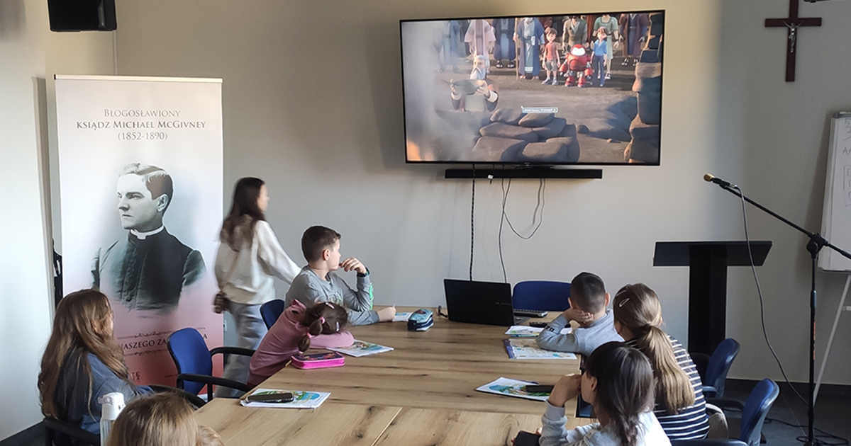 Ukrainian children watch a Bible story during a Greek Catholic catechism class at McGivney House in Radom, Poland, in May.