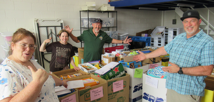 Ray Medhus (center) of Blessed Sacrament Council 10050 in Scottsdale, Ariz., and staff from OCJ Kids — a Phoenix-based organization supporting foster children in group homes — display supplies collected during the council’s back-to-school drive. This is the fourth year Council 10050 has supported OCJ Kids’ Tools4Success campaign, helping collect more than 3,300 items worth over $12,000.