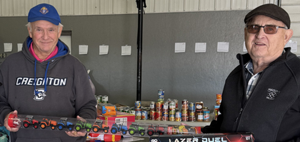 Past Grand Knight Philip Morrow (left) and treasurer Marv Maly of Onawa (Iowa)-Blencoe Council 6249 display some of the toys collected during the council’s Christmas toy drive. 
