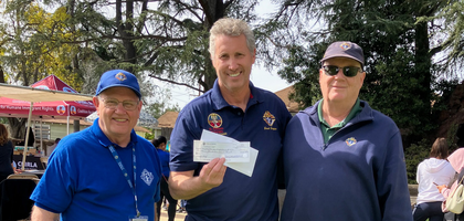 Grand Knight Mike Valerio (right) of St. Timothy Council 12834 in Laguna Niguel, Calif., and California State Deputy Jim Larson (left) present Grand Knight Frank Ferguson of St. Elizabeth of Hungary Council 12452 in Altadena with a check for more than $4,400.
