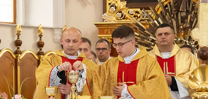 Father Konrad Szymański prays during his ordination Mass.