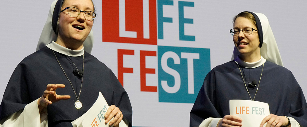 Sister Charity and Sister Cora Caeli of the Sisters of Life serve as emcees during Life Fest at EagleBank Arena in Fairfax, Va., on Jan. 23