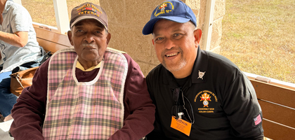 Faithful Navigator Alexander Santos (right) of Archbishop Ambrose De Paoli Assembly 3218 in Cooper City, Fla., sits with a resident of the Alexander “Sandy” Nininger State Veterans’ Nursing Home in Pembroke Pines during the assembly’s visit to the home.