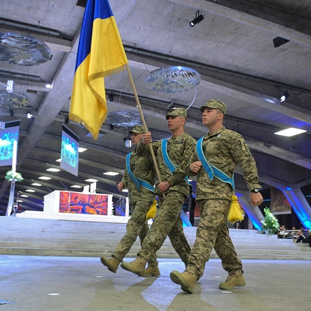 Ukrainian soldiers march into the Basilica of St. Pius X