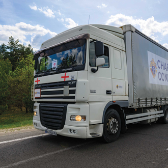 A Knights of Columbus Charity Convoy truck heads toward Lviv from the Polish border