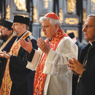 Cardinal Konrad Krajewski, papal almoner, leads an ecumenical prayer service in Lviv on March 10, 2022