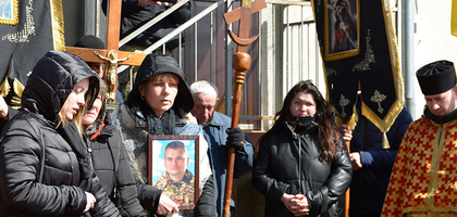 People attending a funeral.