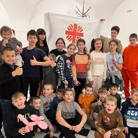 Some of the 36 foster children living in the Caritas home in Rava-Ruska gather for a group photo.