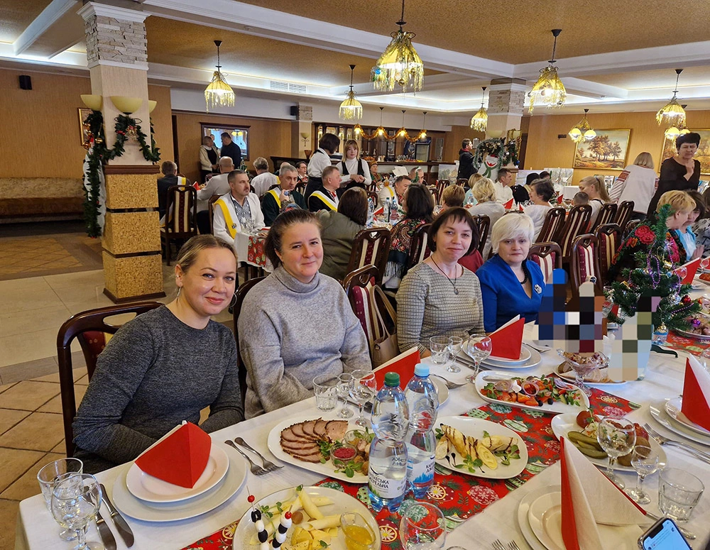 Guests enjoy a meal provided by Blessed Mykolai Charnetsky Council 16890 in Irpin, Kyiv region, during a Christmas dinner hosted for the wives, mothers, and close relatives of fallen soldiers. 