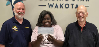 Grand Knight Alan Egging (left) and Past Grand Knight George Sonnen of Father Lucien Galtier Council 4184 in West St. Paul, Minn., present a check for more than $12,000 — proceeds from the council’s annual fundraising campaign — to Kenyatta, a client advocate and life coach at Guiding Star Wakota. The Supreme Council provided an additional $400 through the ASAP program. Father Jeremiah O’Callaghan Council 3659 in Inver Grove Heights also raised about $12,000 for the center, which will use the funds to replace a 12-year-old ultrasound machine.