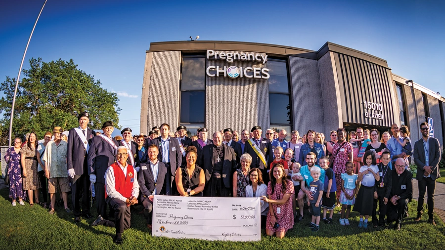  Knights, family members and staff from Pregnancy Choices in Apple Valley after a ceremony to bless the new ultrasound machine the Knights placed at the center