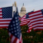 Flags wave in front of the United States Capitol building in Washington, D.C.