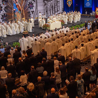 Concelebrating clergy, Knights, family members and other guests pray during the votive Mass of Sts. Joachim and Anne at the 142nd Supreme Convention in Québec City on Aug. 7.