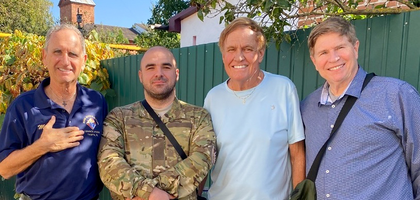 Michael Kaczmarek (left), a member of Msgr. Kevin S. Mullen Council 12956 in Tampa, Fla., and representatives of Catholic Outreach to Neighbors in Ukraine (CONU) stand with an injured Ukrainian soldier during a food distribution at St. Michael the Archangel Parish in Lubny, Ukraine. Council 12956 donated $1,100 to CONU, which used the funds to provide food and hygiene products to older adults affected by the war in Ukraine, and to support a home for mothers and orphans in Kharkiv. Kaczmarek and other CONU supporters traveled to Ukraine to deliver the donations and assist with projects at the home.