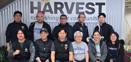 Knights from St. Joseph Council 16099 in Winnipeg, Manitoba, and their family members gather at the Winnipeg Harvest Food Bank during a recent work day. 