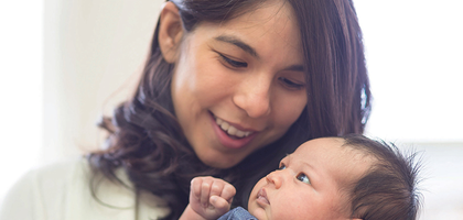 A mother holding her child.