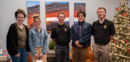 Knights from Father Thomas D. Kraft, O.P. Council 14764 in Salt Lake City present wrapped presents to staff from the Pregnancy Resource Center of Salt Lake City.