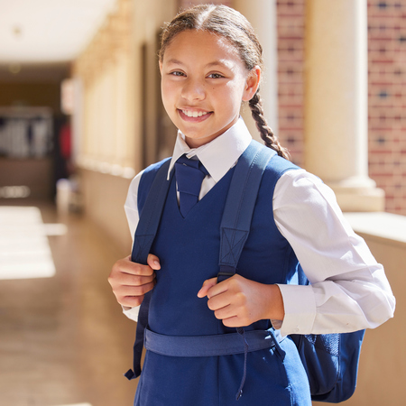 Young girl in school uniform with backback.jpg